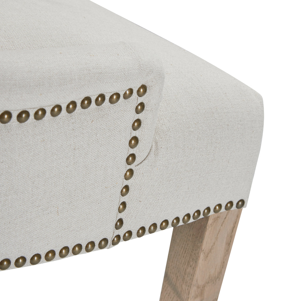 Detail of upholstery and studding on Hamilton dining chair in oatmeal
