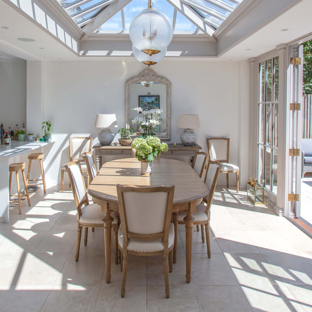 Furnishing an Orangery Extension: How to Create a Luxurious Dining & Living Space that seamlessly blends indoor comfort with the beauty of the outdoors.