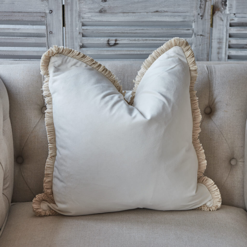 Ivory soft velvet cushion with thick fringe