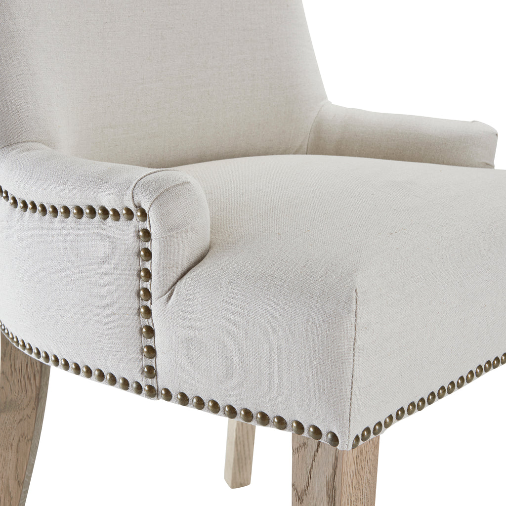 Close up of brass studded detail on Hamilton chair in oatmeal
