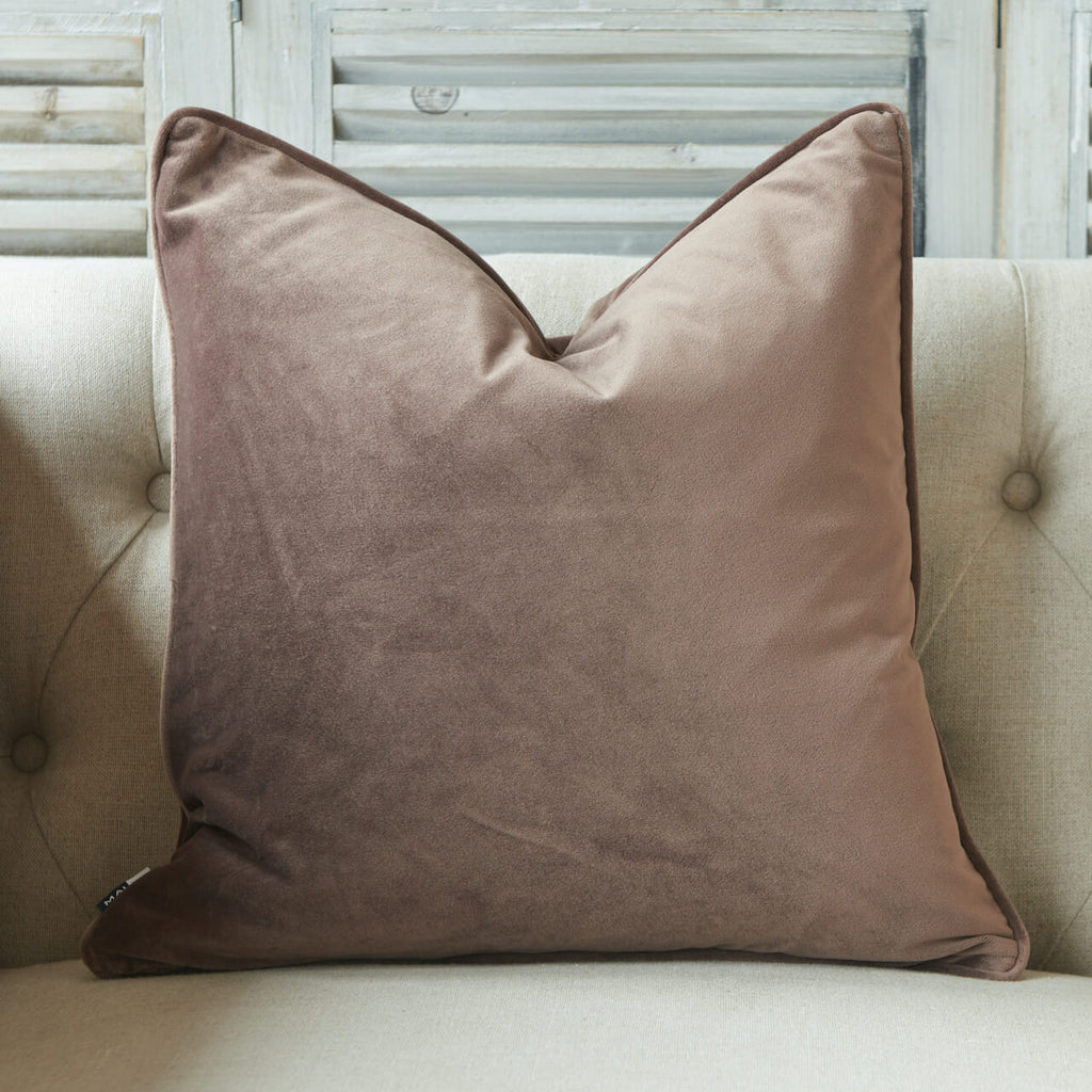 Soft matte luxury velvet cushion with piped edge in a truffle colour