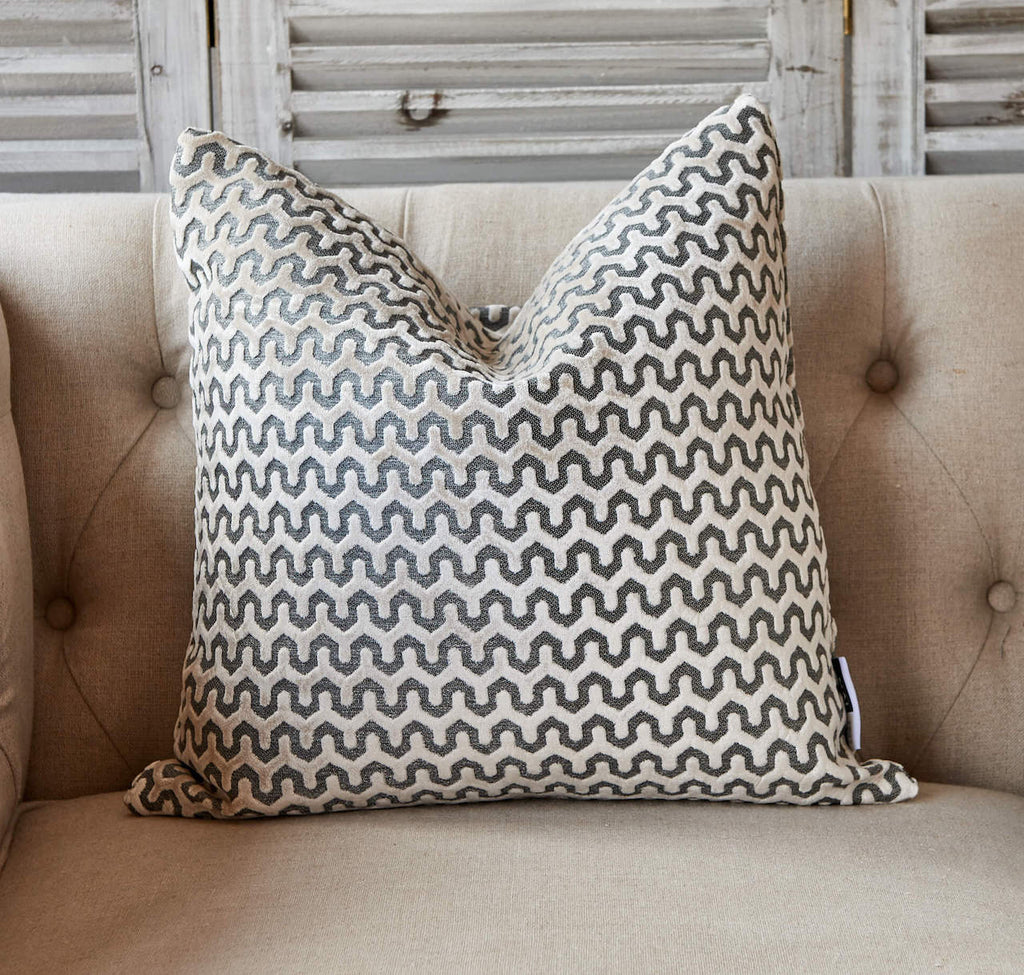 Grey wave pattern cushion on natural background